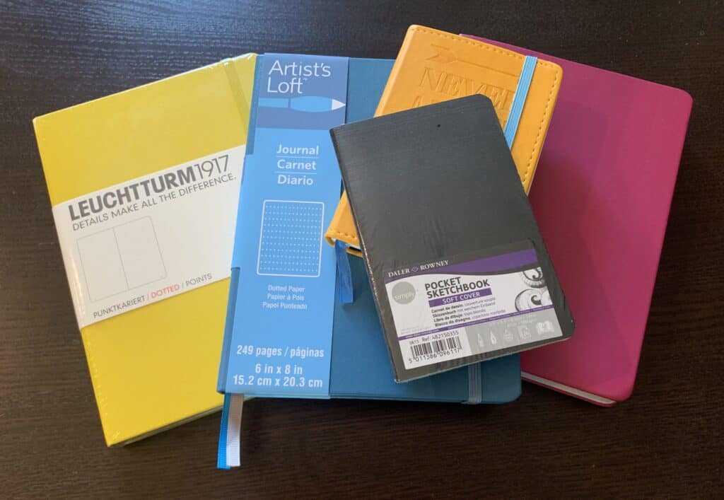 Different brands of notebooks in different sizes